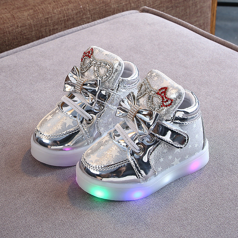 Zapatillas con botón mágico de LED